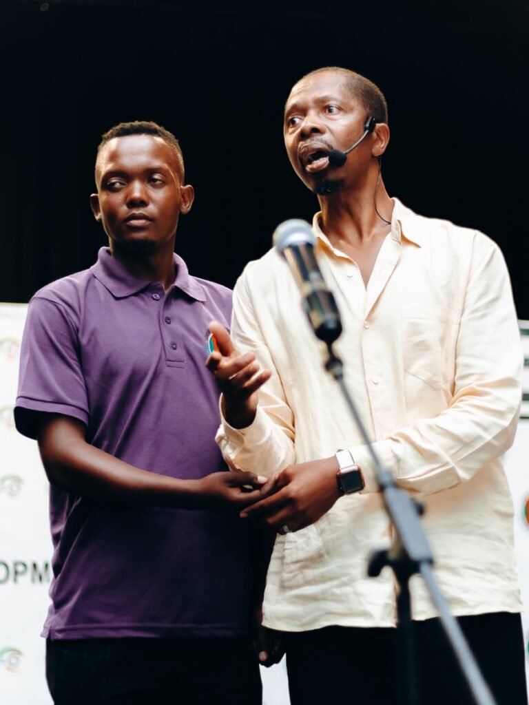 Tshepo Oliphant with Prof. Tikolo, refining technique, at Professor Tikolo's masterclass at the COMFESA North West International Symposium in Rustenburg